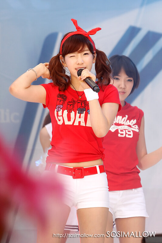 woman singing on stage