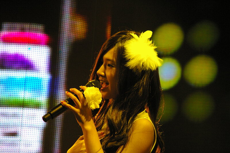 woman singing on stage