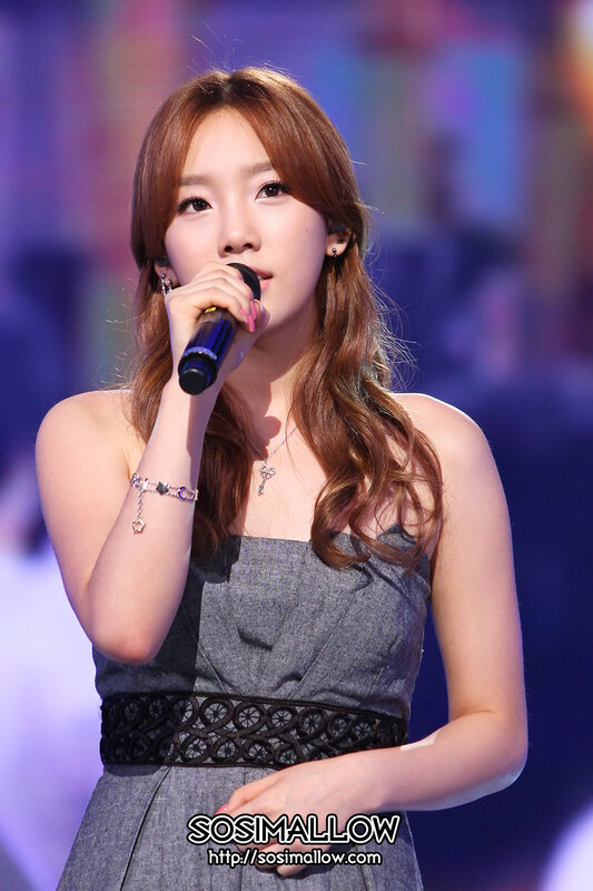 woman singing on stage