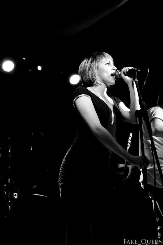 woman singing on stage