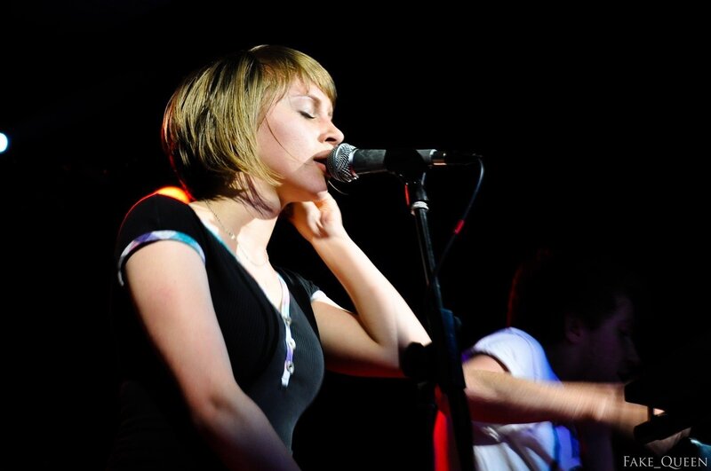 woman singing on stage