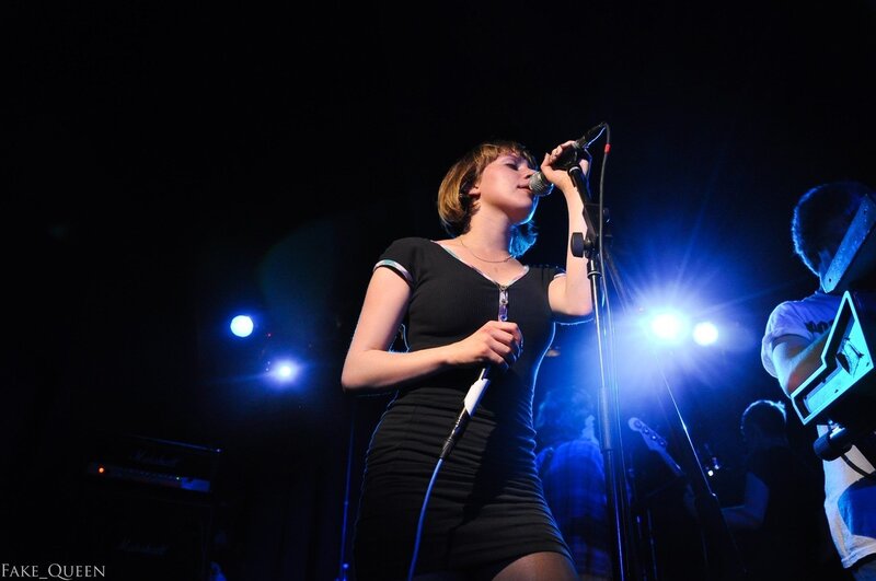 woman singing on stage