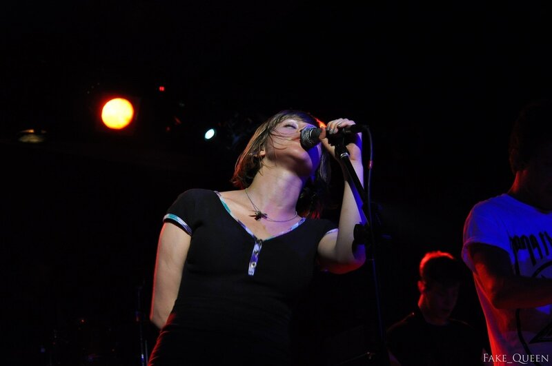 woman singing on stage
