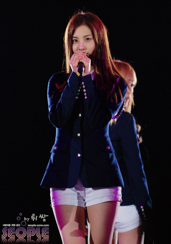 woman singing on stage