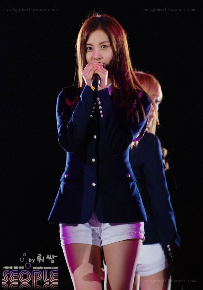 woman singing on stage