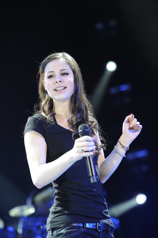 woman singing on stage