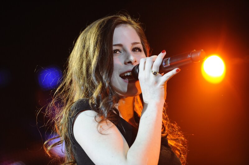woman singing on stage