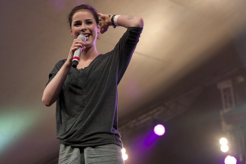 Woman singing on stage