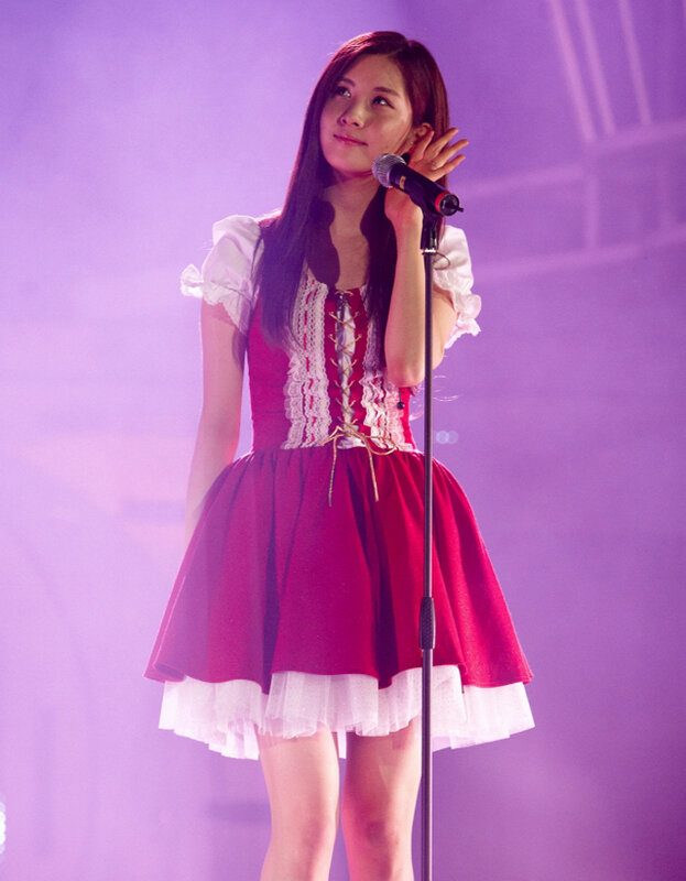woman singing on stage