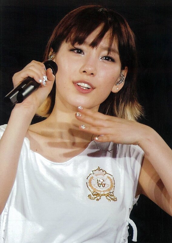 woman singing on stage