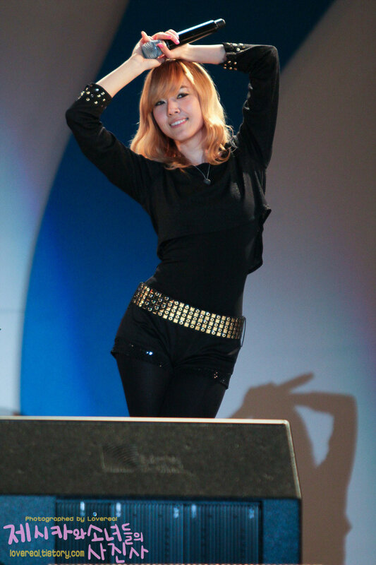 woman singing on stage