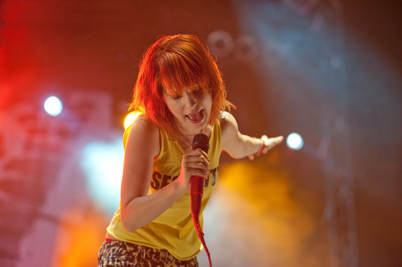 woman singing on stage