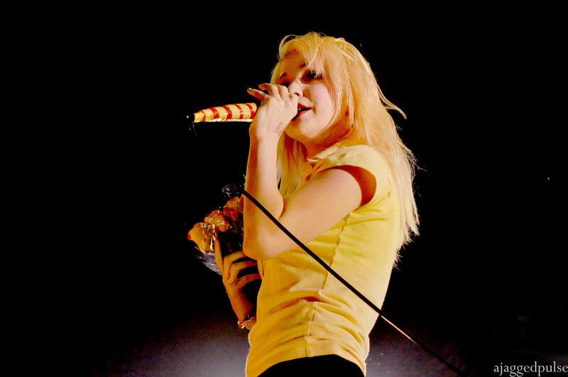 woman singing on stage