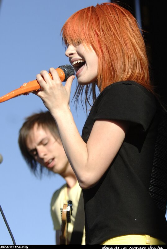 woman singing on stage