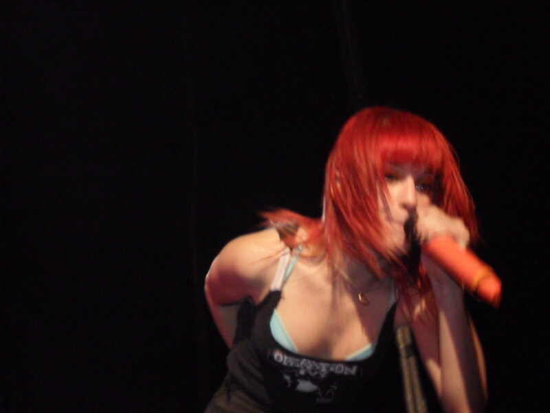 woman singing on stage