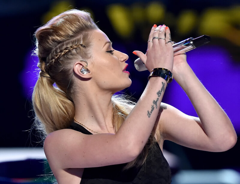 woman singing on stage