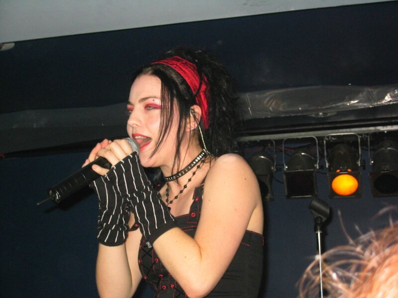 woman singing on stage