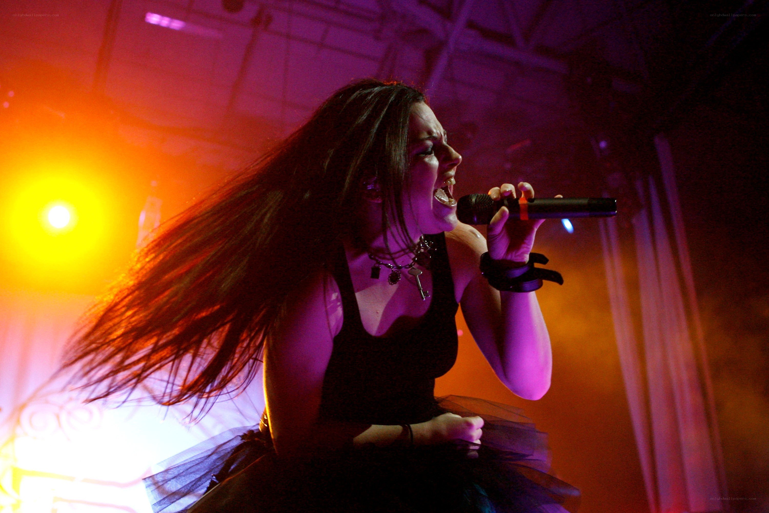 woman singing on stage