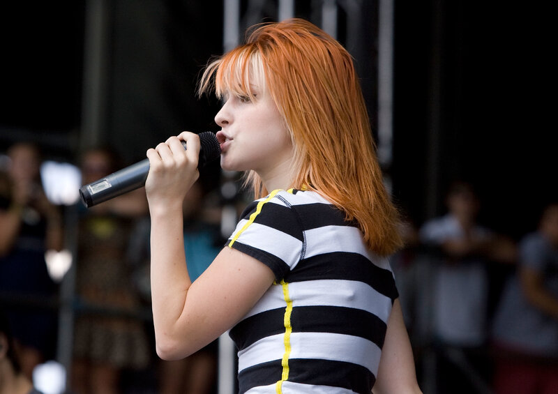woman singing on stage