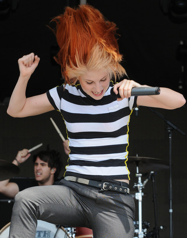 woman singing on stage