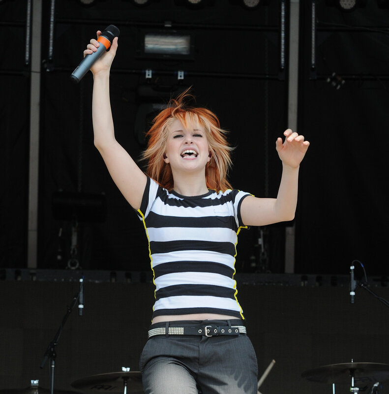 woman singing on stage