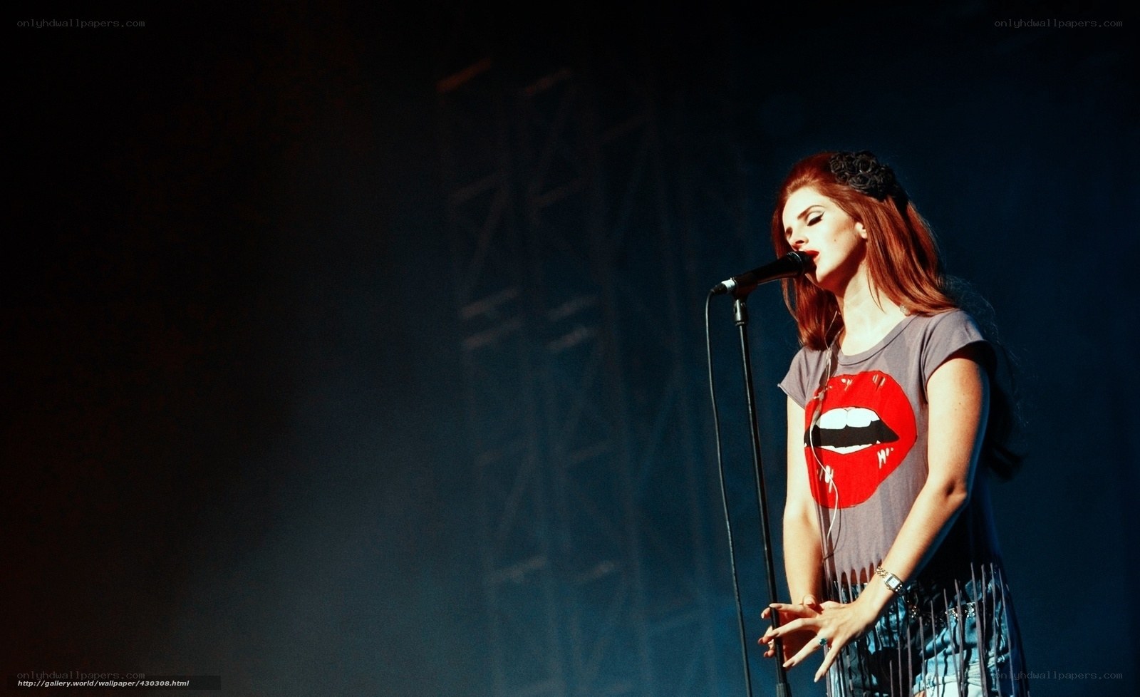 woman singing on stage