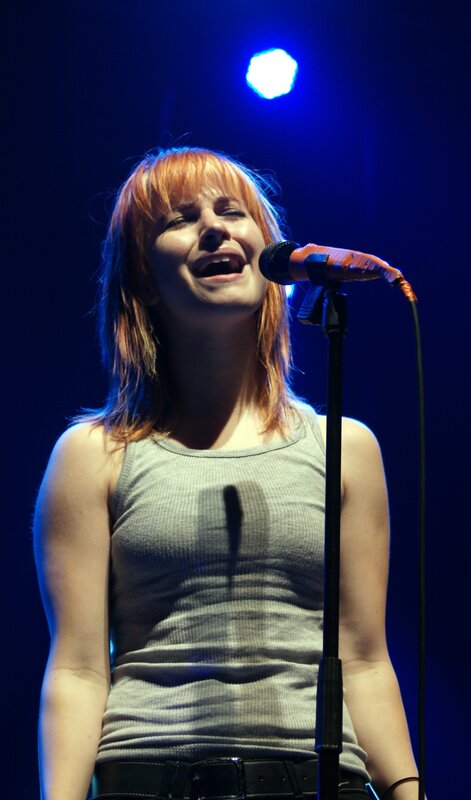 woman singing on stage
