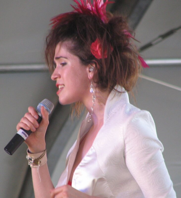 woman singing on stage