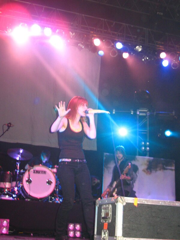 woman singing on stage