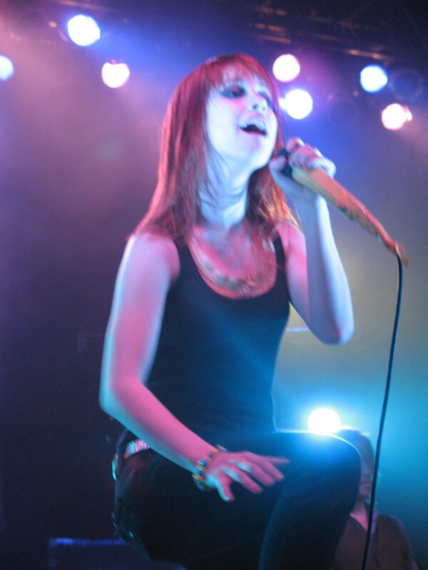 woman singing on stage