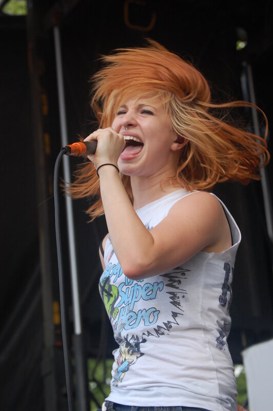 woman singing on stage