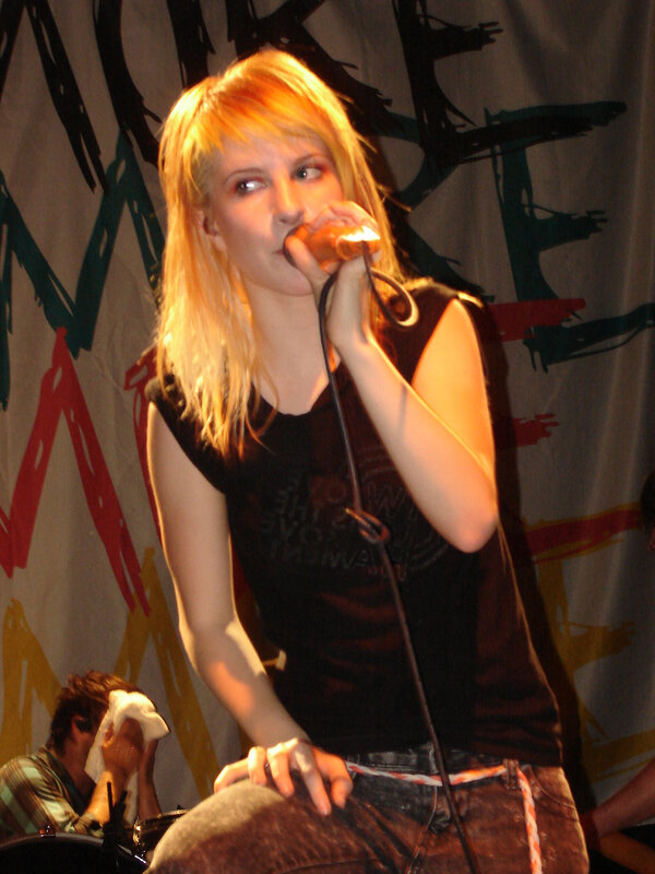 woman singing on stage