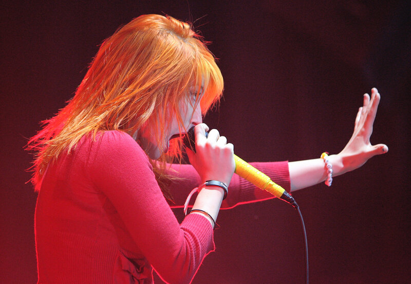 woman singing on stage