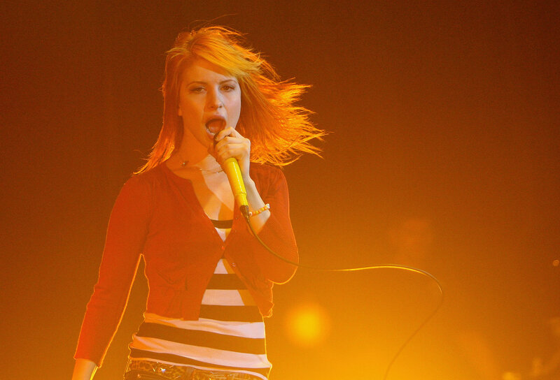 woman singing on stage