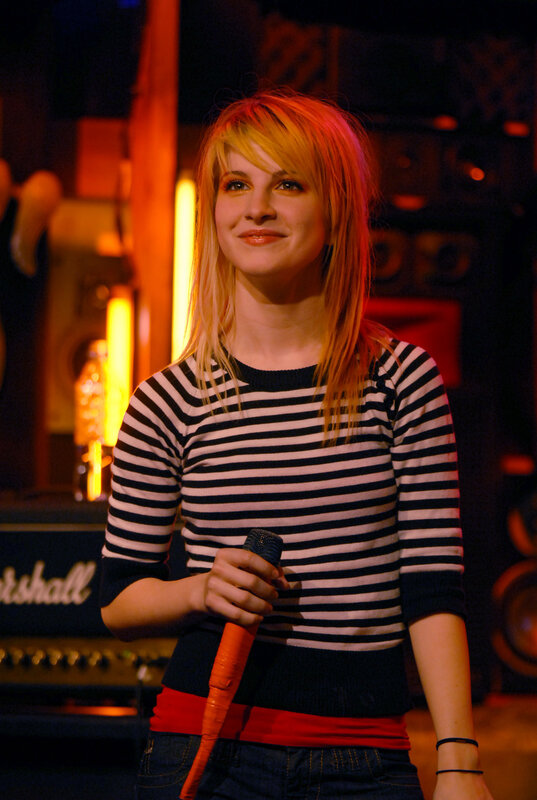 Woman singing on stage