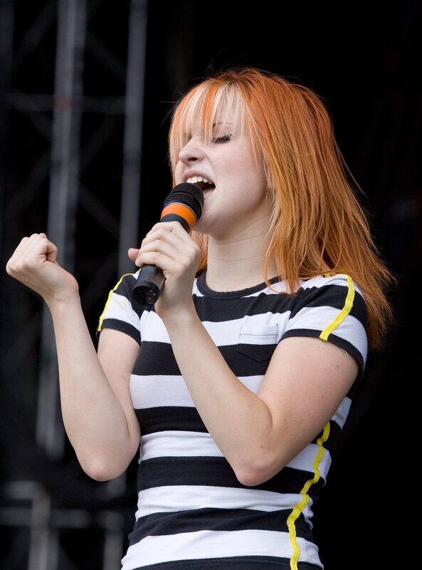 woman singing on stage