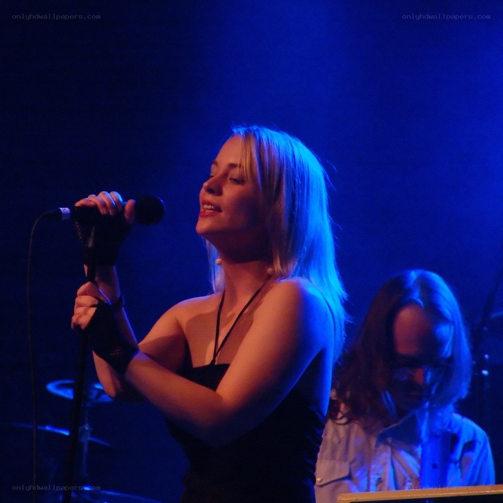 Woman singing on stage