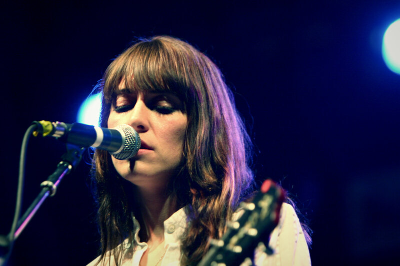 woman singing on stage