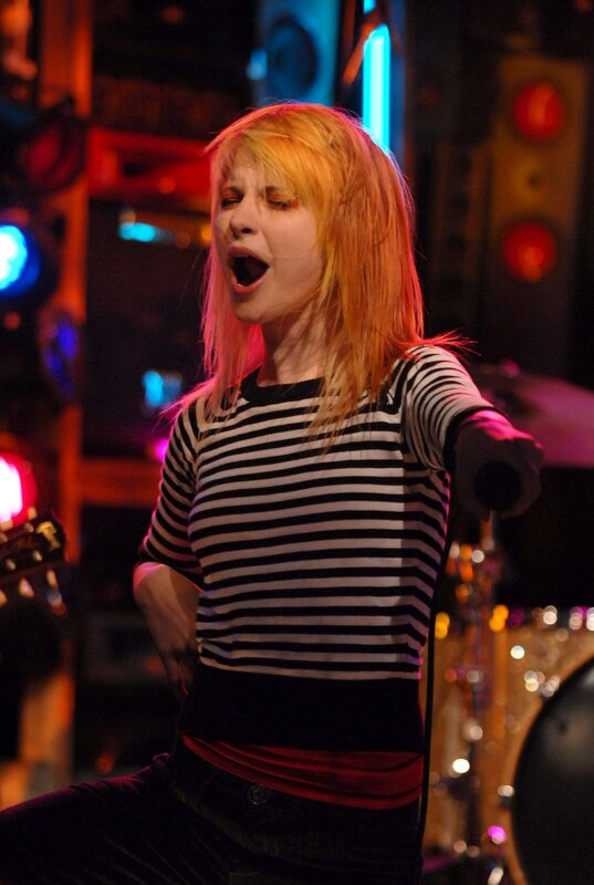 woman singing on stage