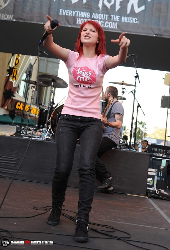 woman singing on stage
