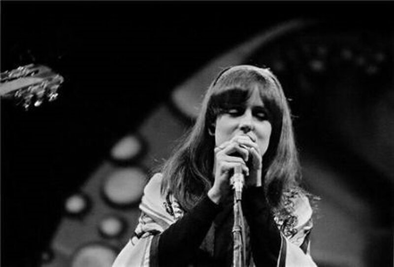 woman singing on stage