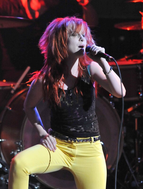 woman singing on stage
