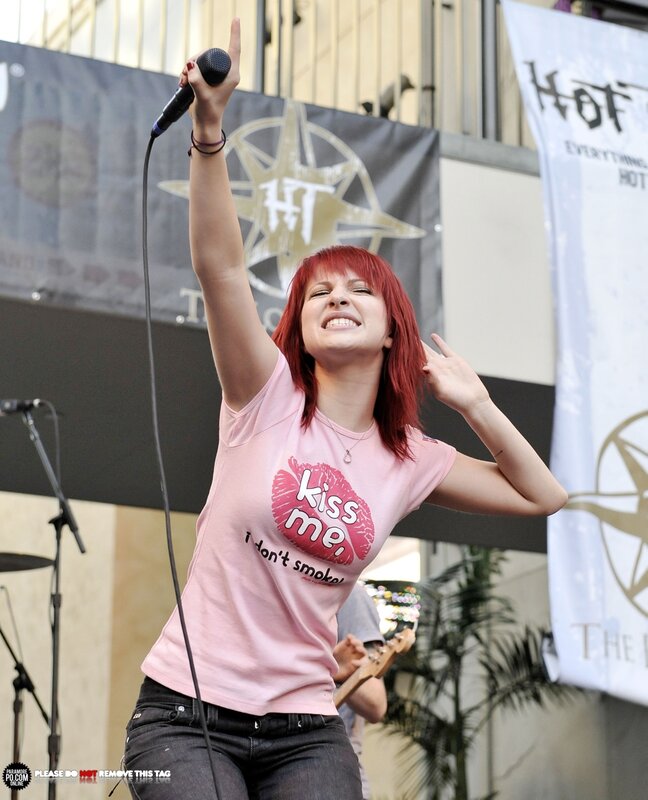 woman singing on stage