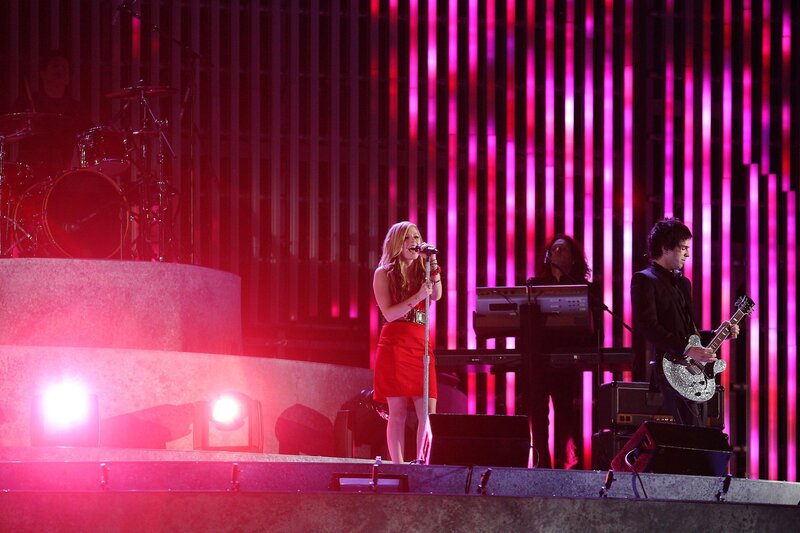 woman singing on stage
