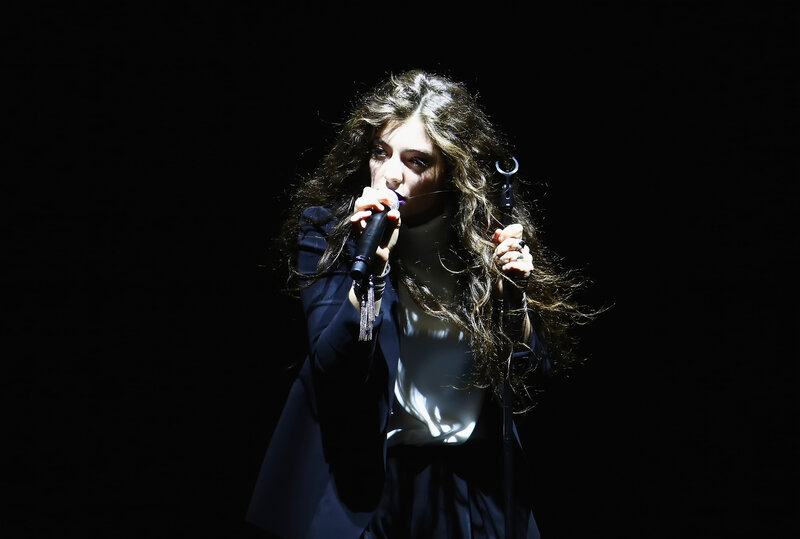 woman singing on stage