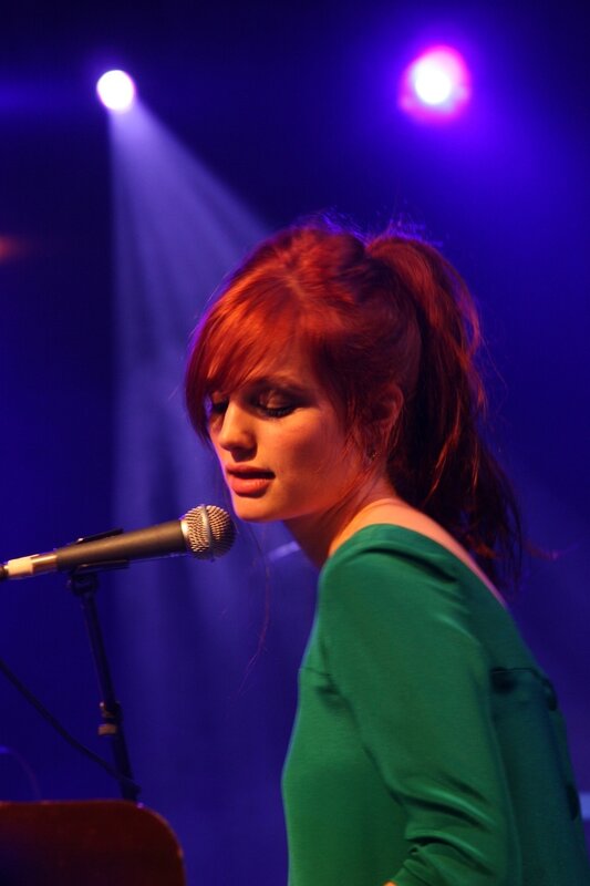 Woman singing on stage