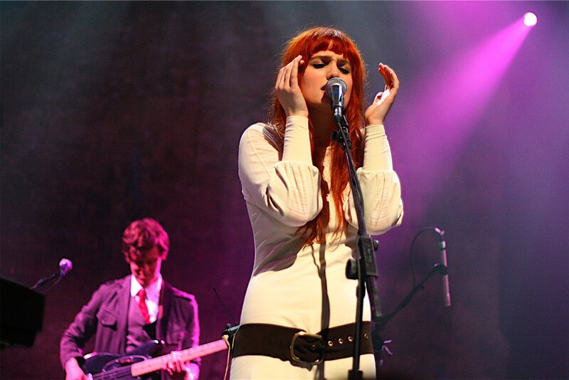 woman singing on stage