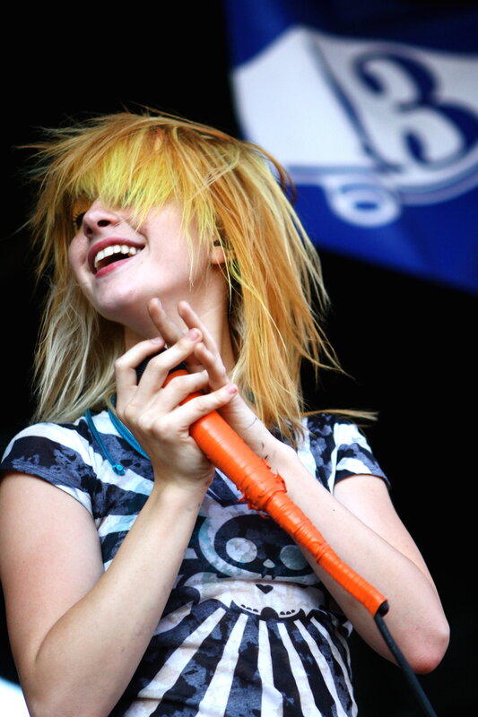 woman singing on stage