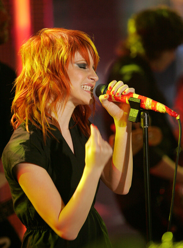 woman singing on stage