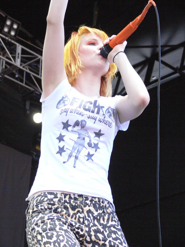 woman singing on stage